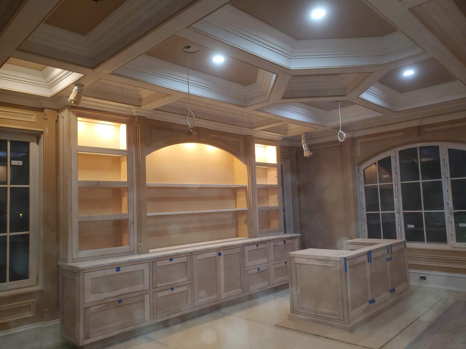 Maple built-in wall unit with a matching coffered ceiling
