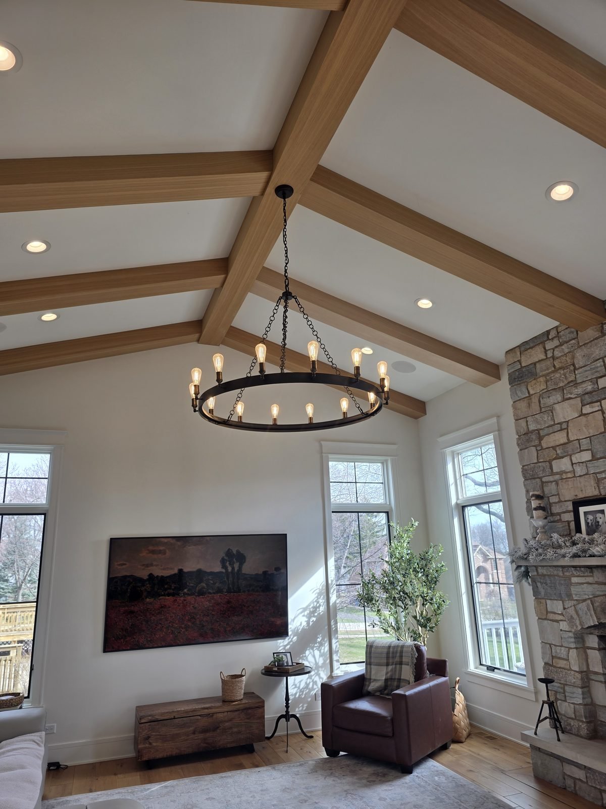 White oak beams across a vaulted living room ceiling